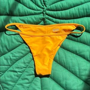 NWOT Benoa Swim made in Hawaii orange Bella bikini bottom. Size L. Never worn